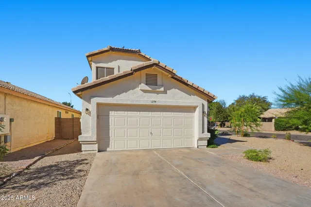a front view of a house with a garage