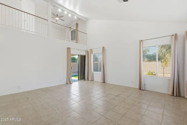 a view of a hallway with wooden shelves