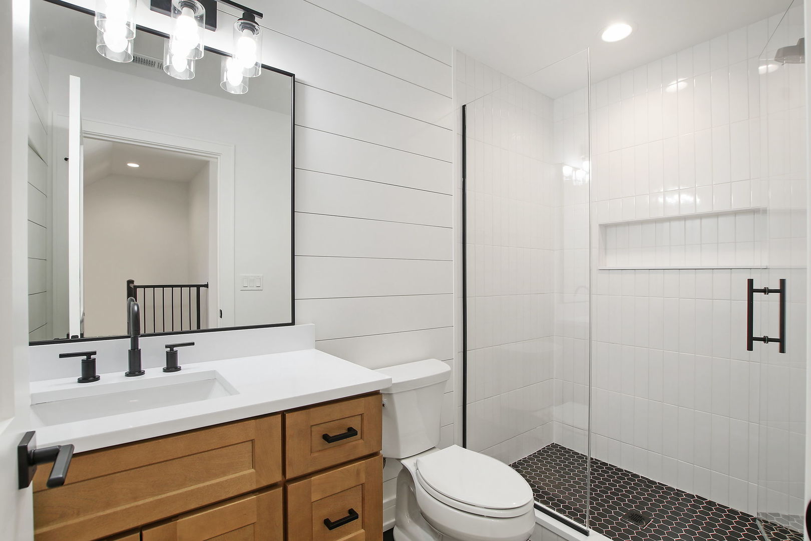 N1812 Hillside Road Linn, WI 53147 - Photo 35 of 52 a bathroom with a sink a toilet a mirror and shower