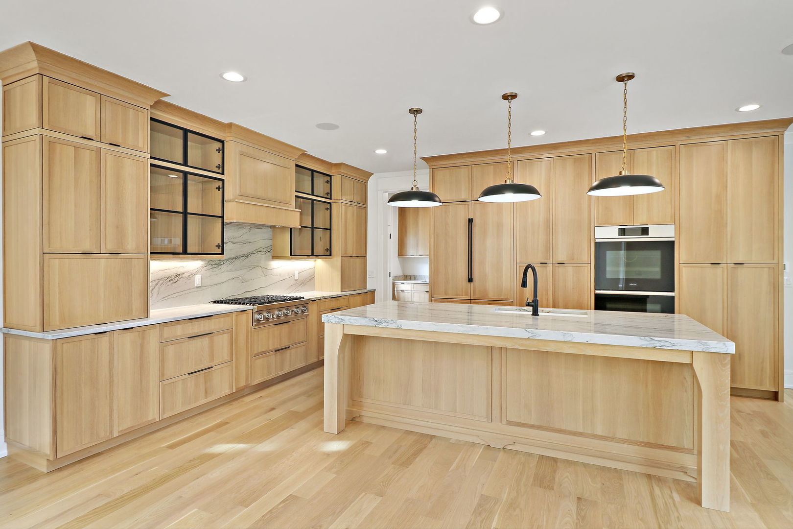 N1812 Hillside Road Linn, WI 53147 - Photo 10 of 52 a large kitchen with granite countertop a sink and white cabinets