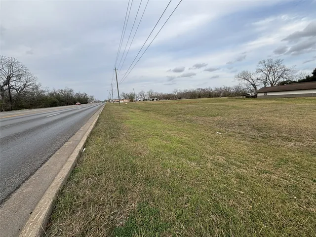 a view of a field with an ocean