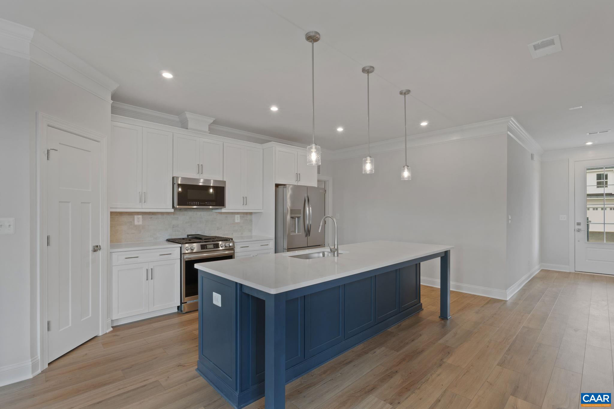 140 Springdale Road Waynesboro, VA 22980 - Photo 11 of 37 a kitchen with stainless steel appliances a sink stove and wooden floor