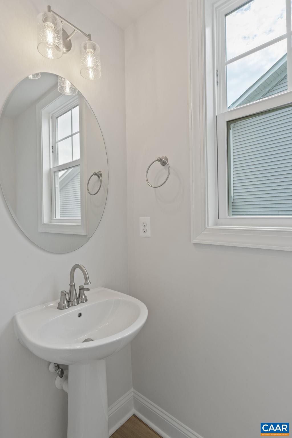 140 Springdale Road Waynesboro, VA 22980 - Photo 6 of 37 a bathroom with a sink a mirror and a window