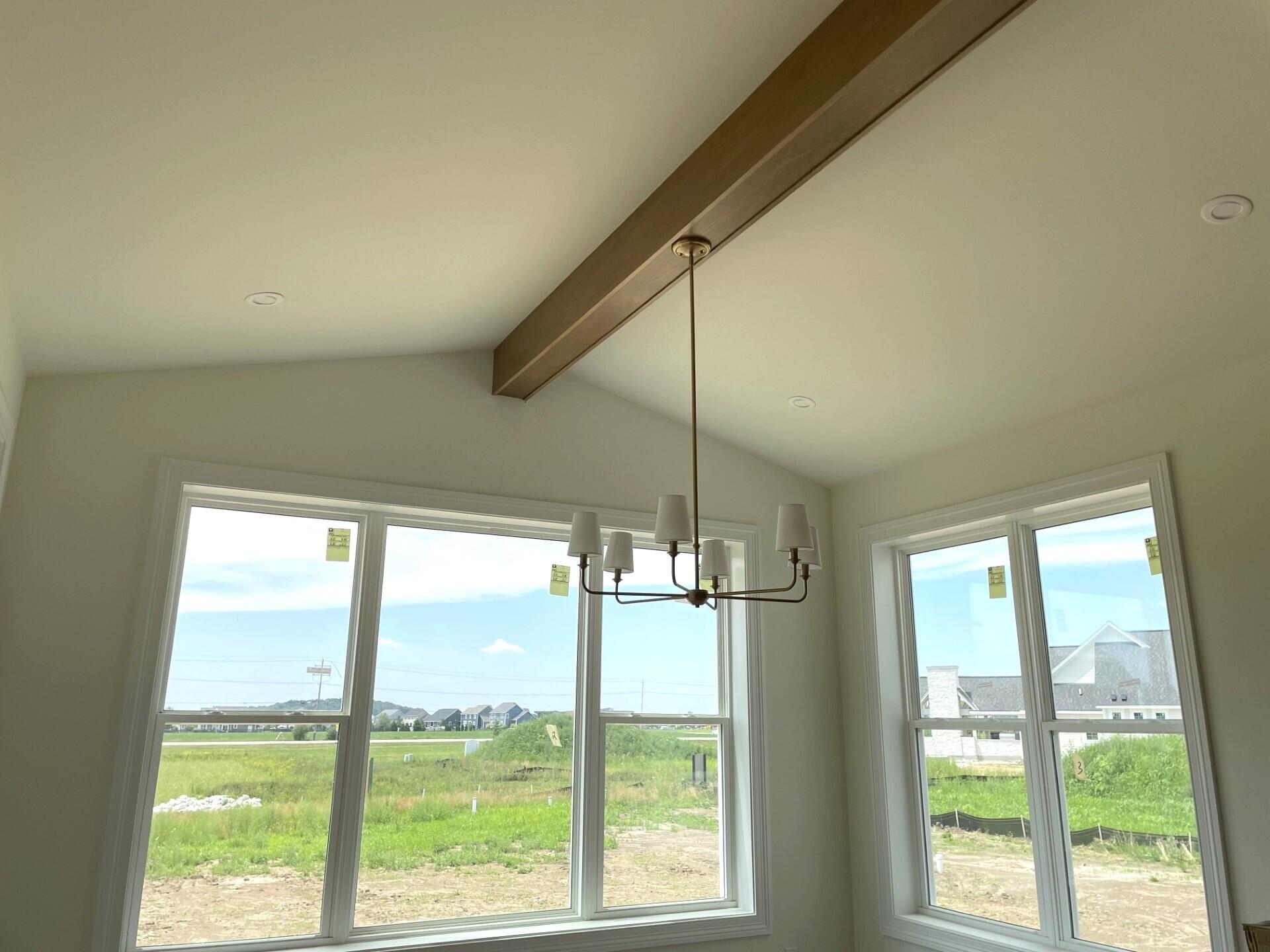 W358-n6309 W358-n6309 Ennis Road Oconomowoc, WI 53066 - Photo 17 of 47 Bright Dinette w/ Vaulted Ceiling & Beam