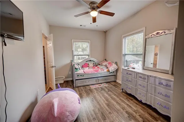 a bed room with a bed and a television