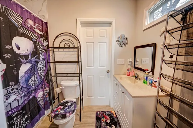 a bathroom with a sink a vanity and a mirror