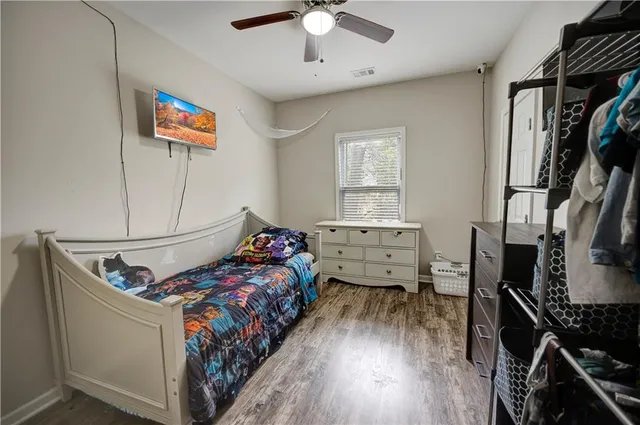 a bedroom with furniture and a window