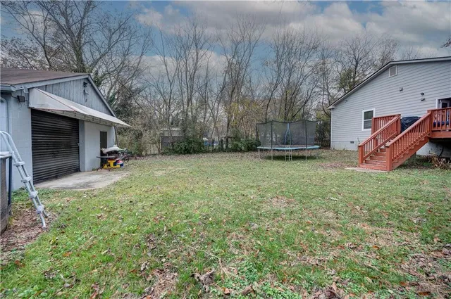 a view of a couches in backyard of house