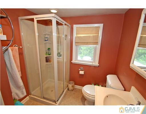28 Sine Road Edison, NJ 08817 - Photo 14 of 23 a bathroom with a toilet and a shower