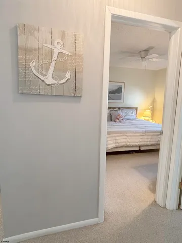 a view of a bedroom with a bed and couch