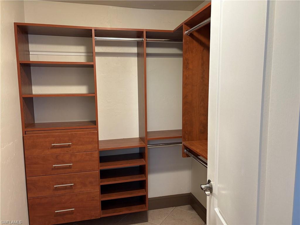 804 Bluebird Street Naples, FL 34104 - Photo 15 of 42 Spacious closet with light tile patterned flooring