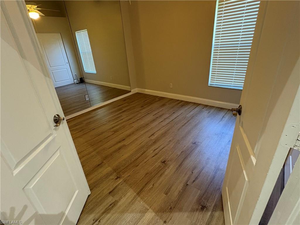 804 Bluebird Street Naples, FL 34104 - Photo 22 of 42 Empty room with light wood-style floors