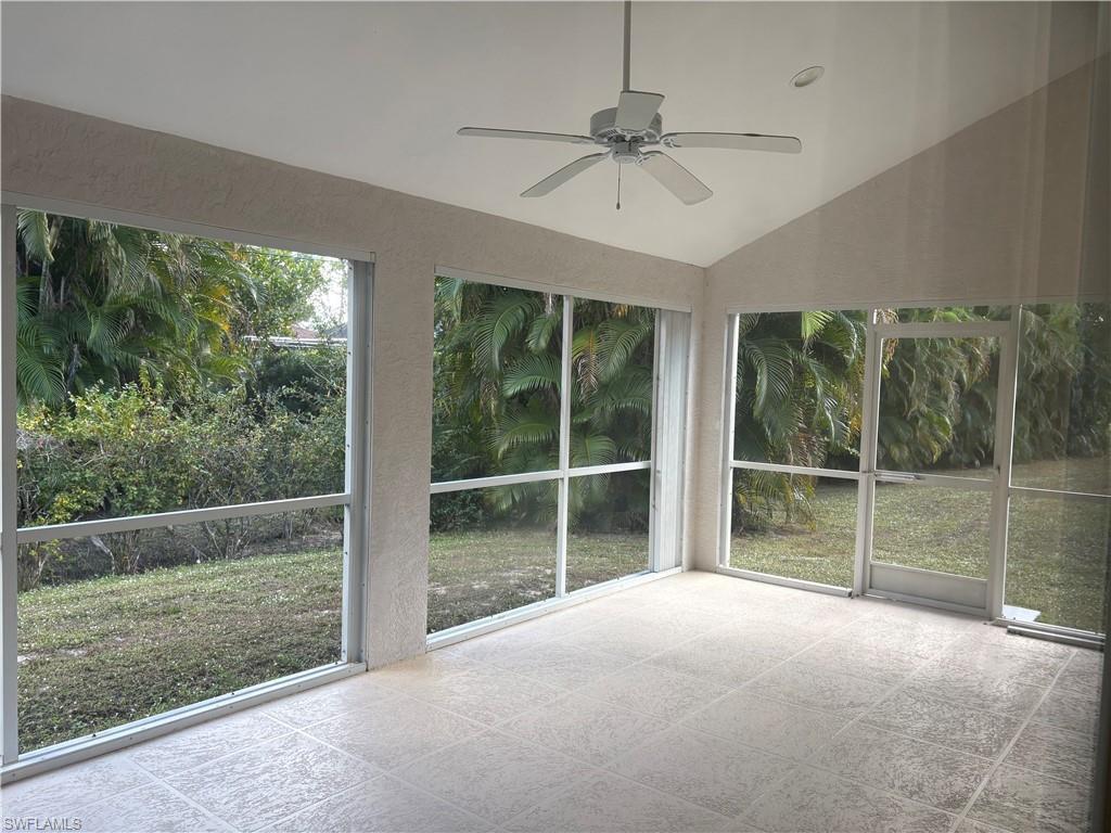 804 Bluebird Street Naples, FL 34104 - Photo 32 of 42 Unfurnished sunroom featuring a ceiling fan, lofted ceiling, and plenty of natural light