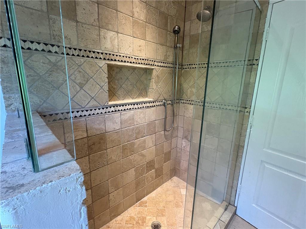 804 Bluebird Street Naples, FL 34104 - Photo 4 of 42 Full bathroom with tiled shower