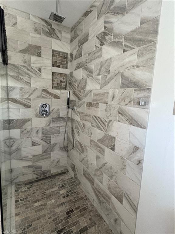 804 Bluebird Street Naples, FL 34104 - Photo 7 of 42 Bathroom featuring tiled shower