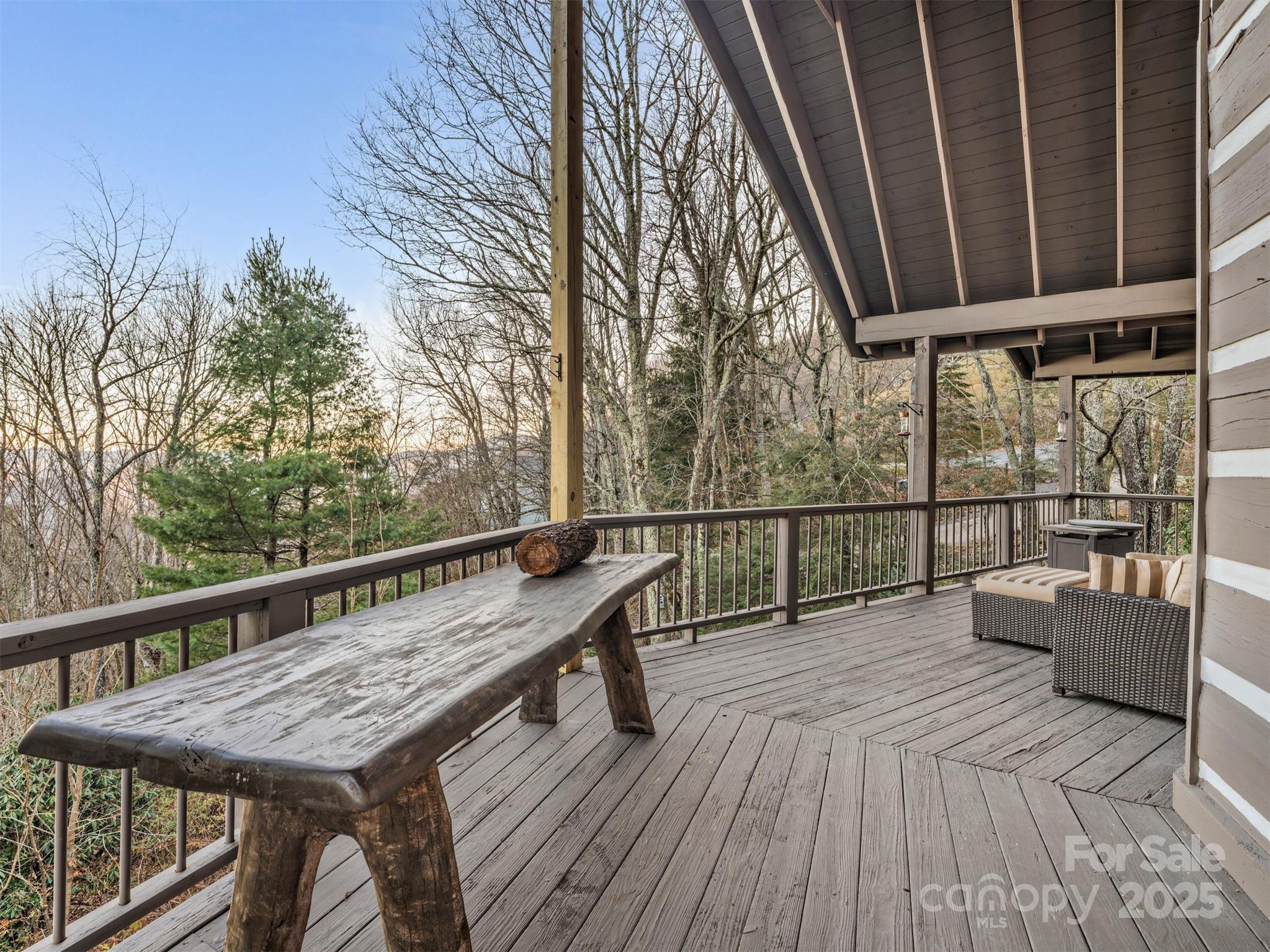 135 Grouse Point Road Maggie Valley, NC 28751 - Photo 15 of 48 a roof deck with wooden floor and fence