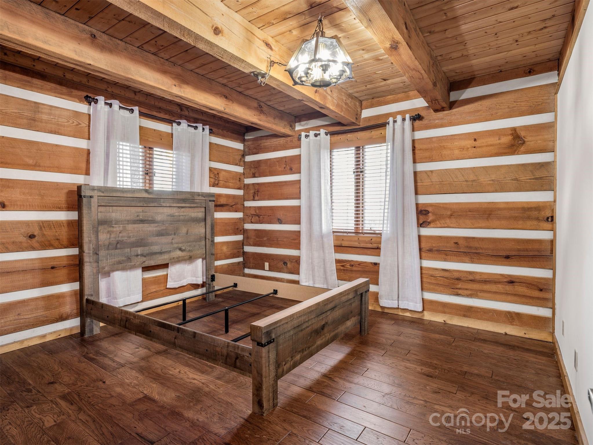 135 Grouse Point Road Maggie Valley, NC 28751 - Photo 21 of 48 a living room with fireplace furniture and a chandelier