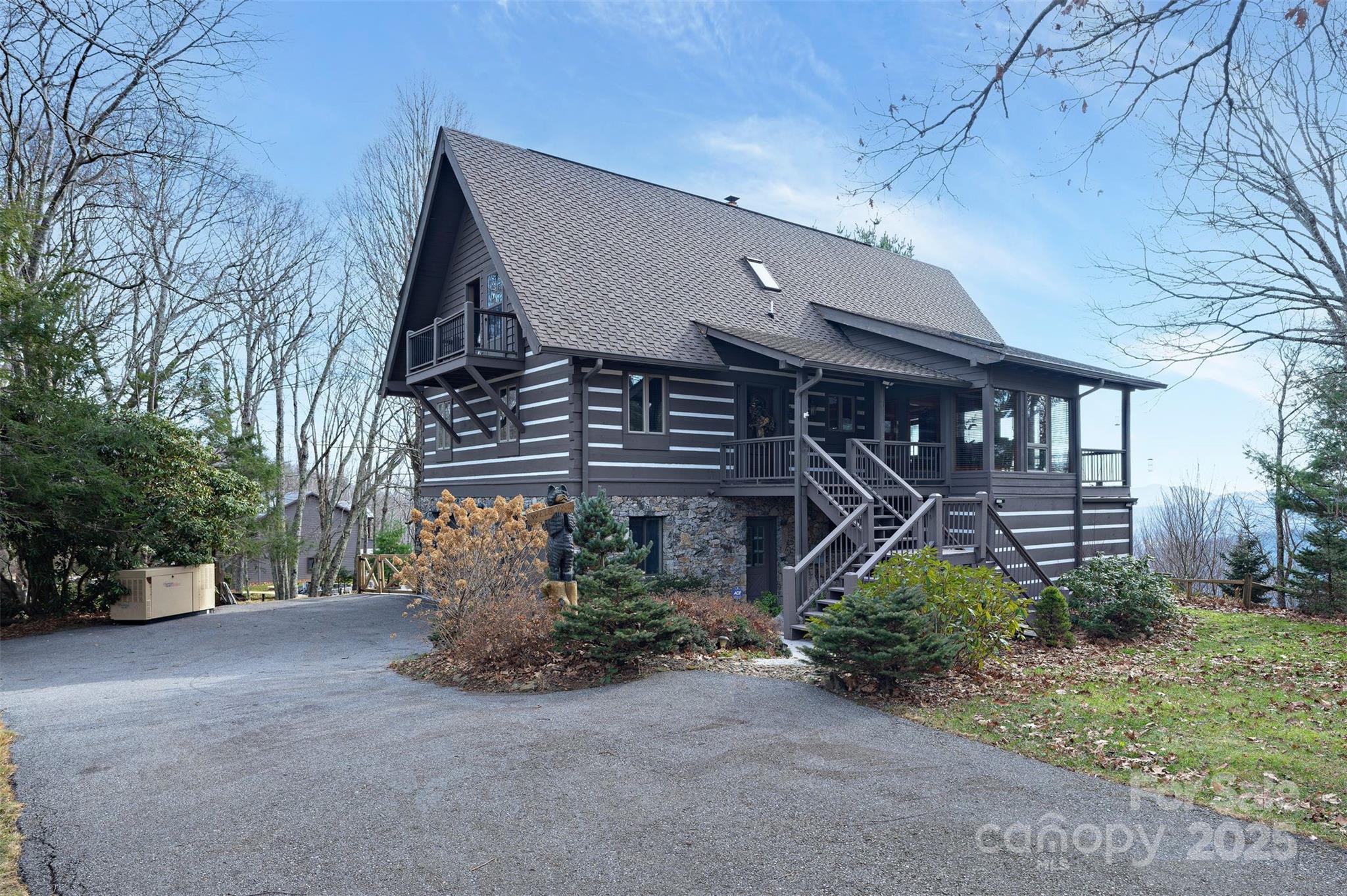 135 Grouse Point Road Maggie Valley, NC 28751 - Photo 41 of 48 a front view of a house with garden
