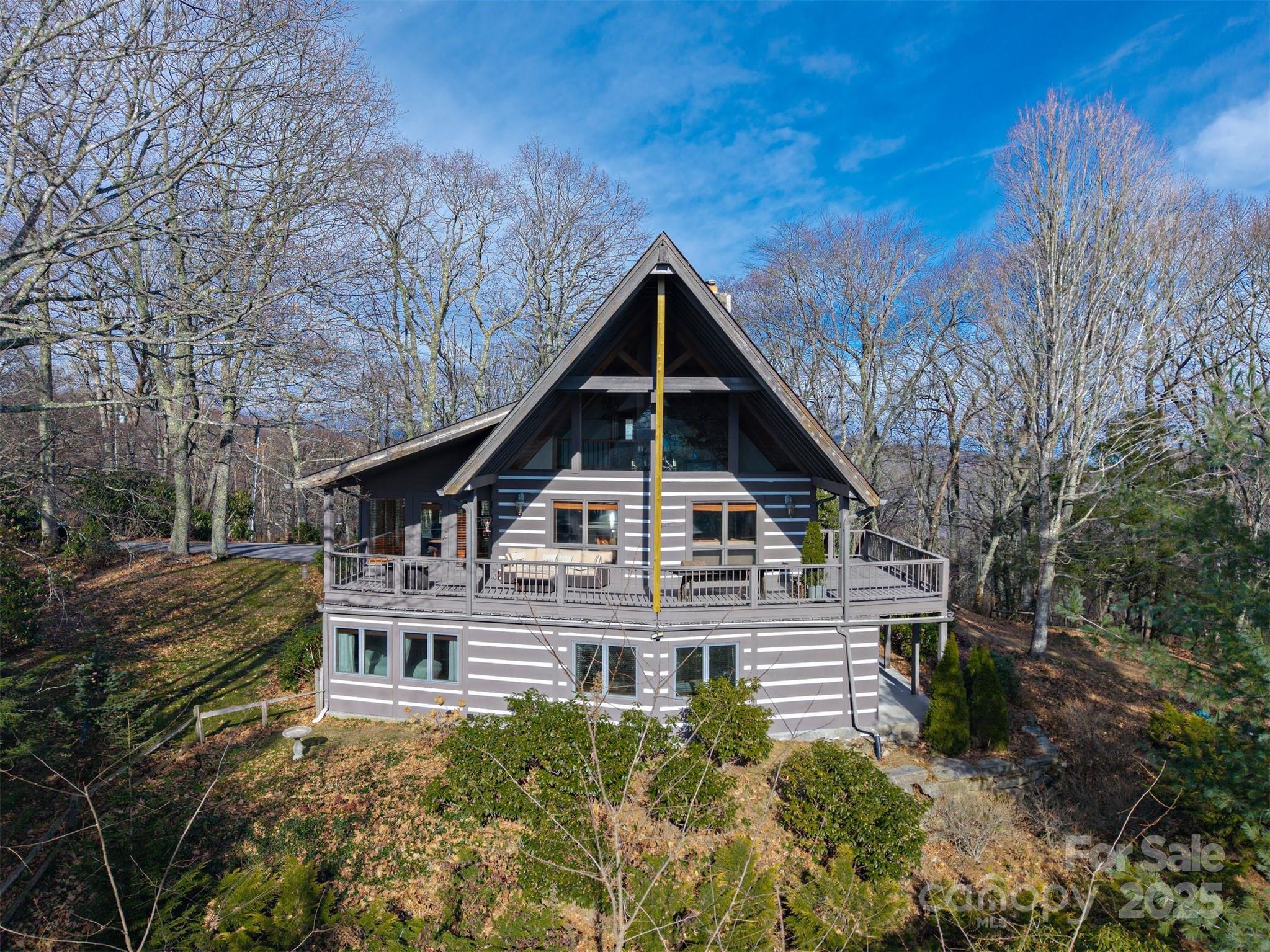 135 Grouse Point Road Maggie Valley, NC 28751 - Photo 46 of 48 a view of a house with a yard