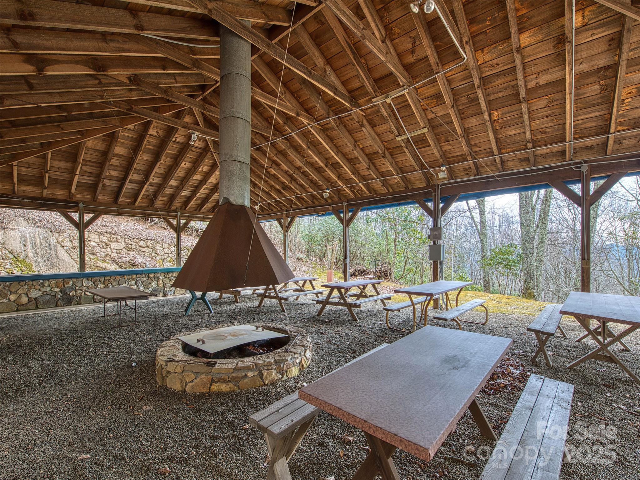 135 Grouse Point Road Maggie Valley, NC 28751 - Photo 48 of 48 a backyard of a house with outdoor seating