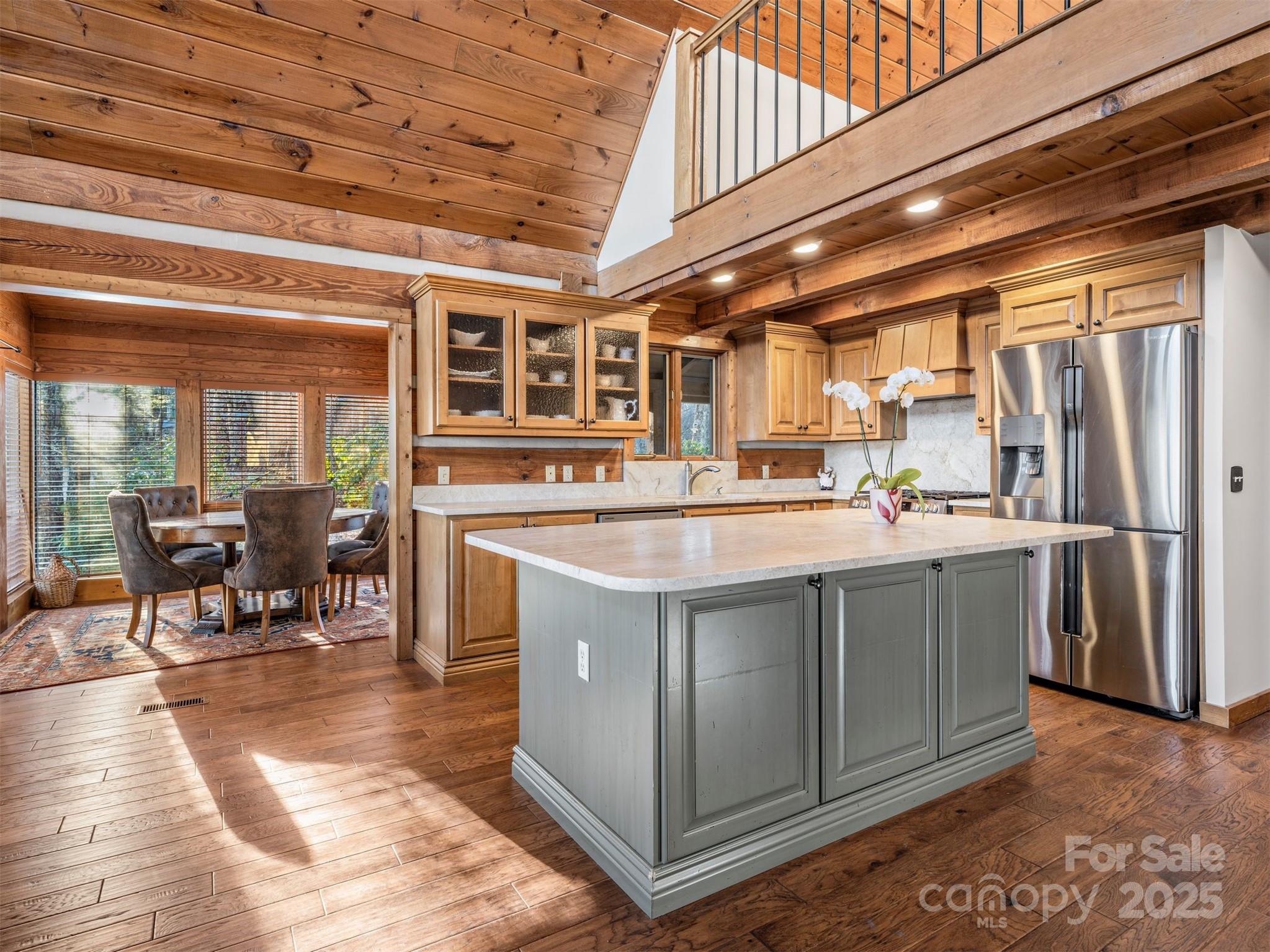 135 Grouse Point Road Maggie Valley, NC 28751 - Photo 9 of 48 a kitchen with stainless steel appliances granite countertop a stove a sink and a refrigerator