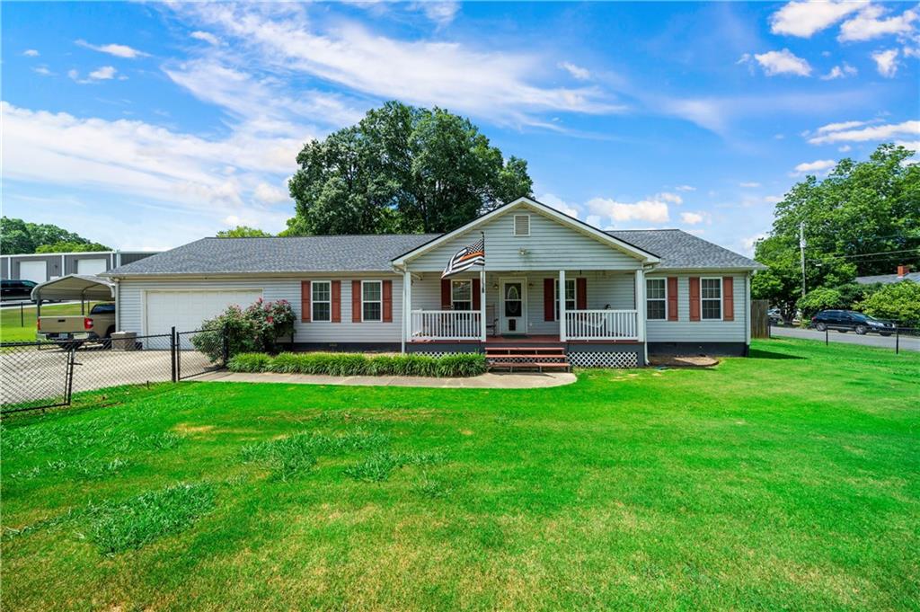 302 Superba Avenue Northeast Rome, GA 30161 - Photo 1 of 1 a front view of a house with a garden