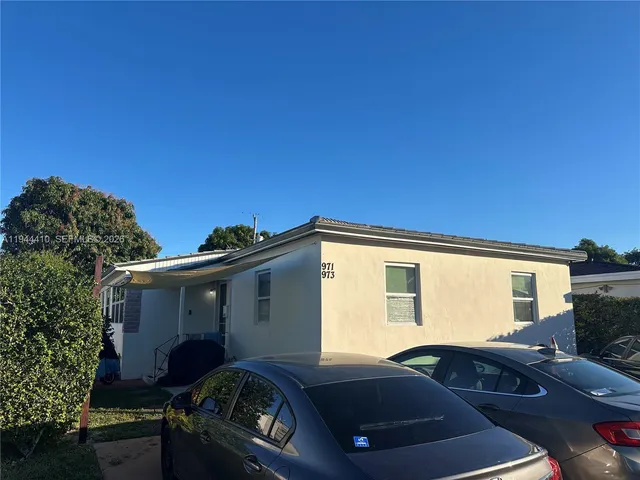 a view of a car parked in front of a house