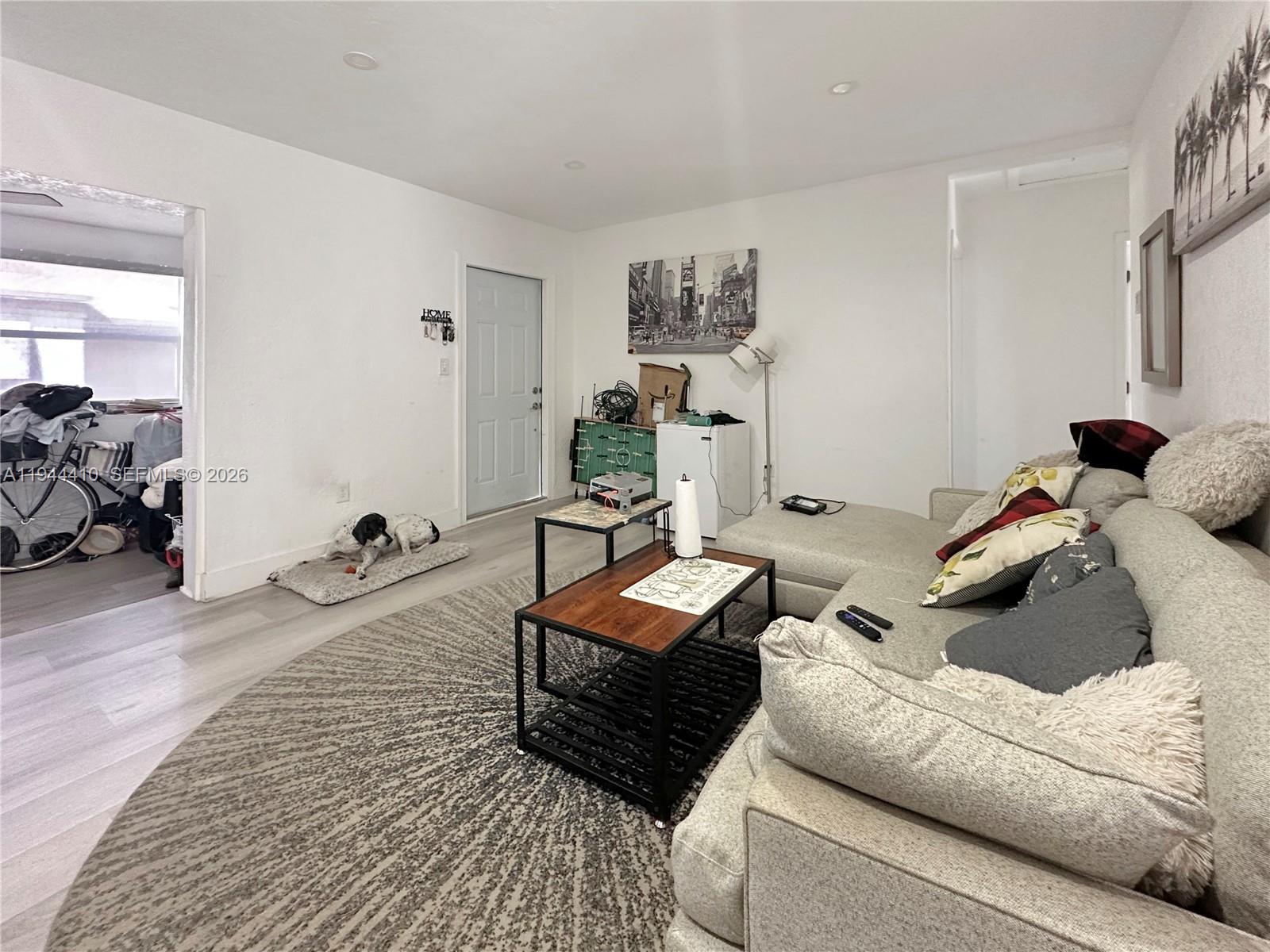 971 79th Terrace Miami Beach, FL 33141 - Photo 3 of 11 a living room with furniture and a wooden floor