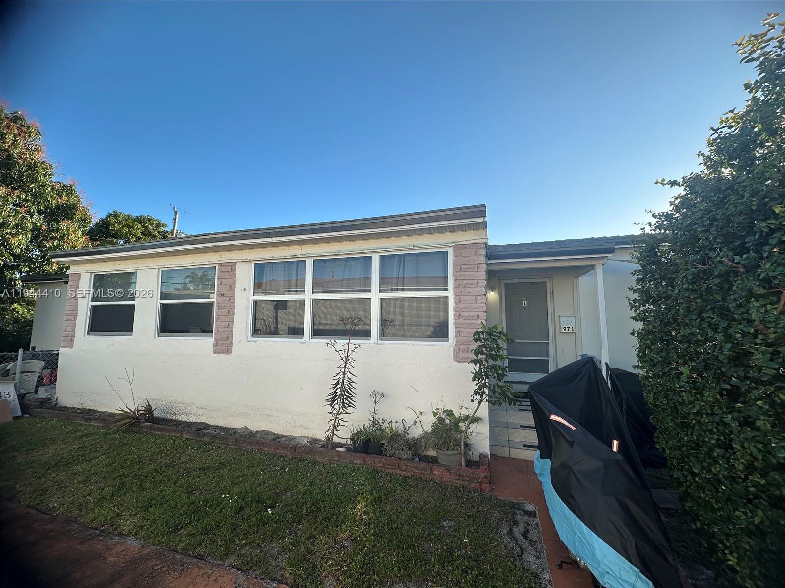 971 79th Terrace Miami Beach, FL 33141 - Photo 10 of 11 a house view with a garden space