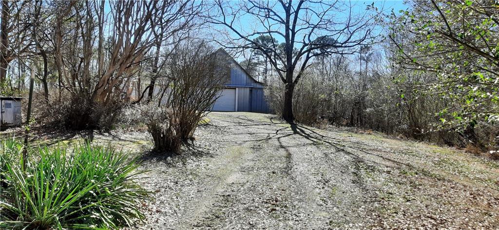 11953 Henderson Mountain Road Fairmount, GA 30139 - Photo 8 of 46 a view of backyard of house