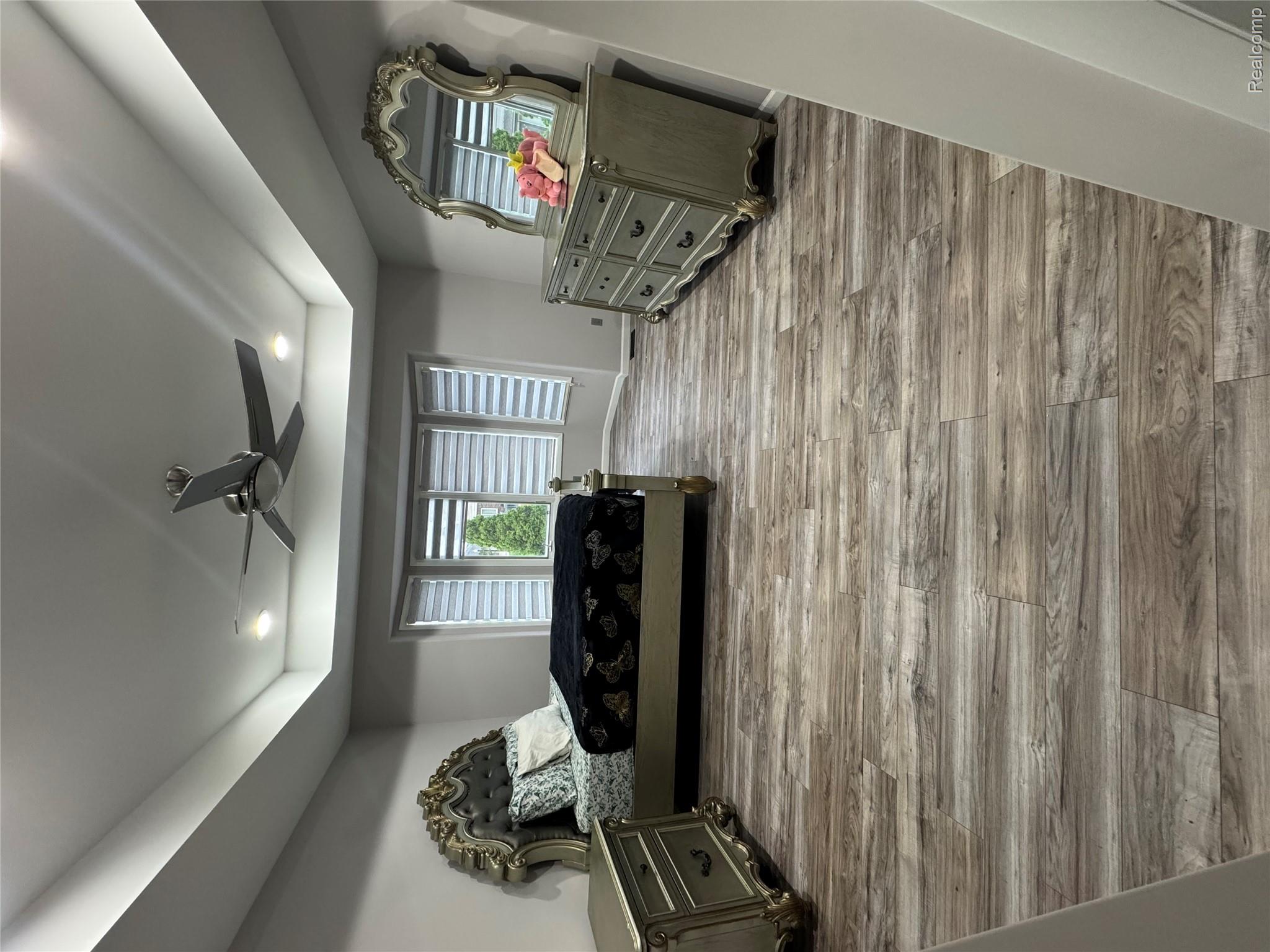 50493 Nesting Ridge Drive Macomb, MI 48044 - Photo 12 of 34 Bedroom featuring a raised ceiling, light wood-type flooring, ceiling fan, and recessed lighting