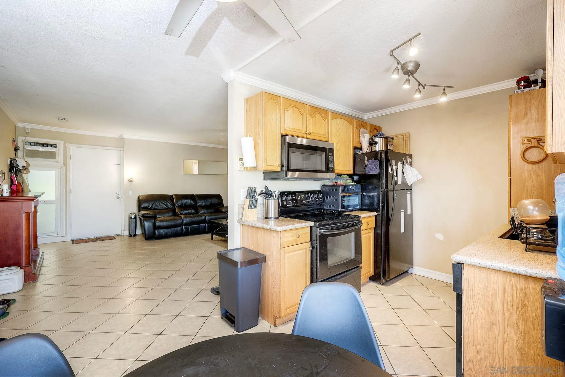 12923 Mapleview Street, Unit 6 Lakeside, CA 92040 - Photo 3 of 25 a kitchen with sink refrigerator and cabinets