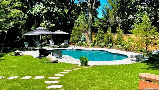 a view of a swimming pool with a garden