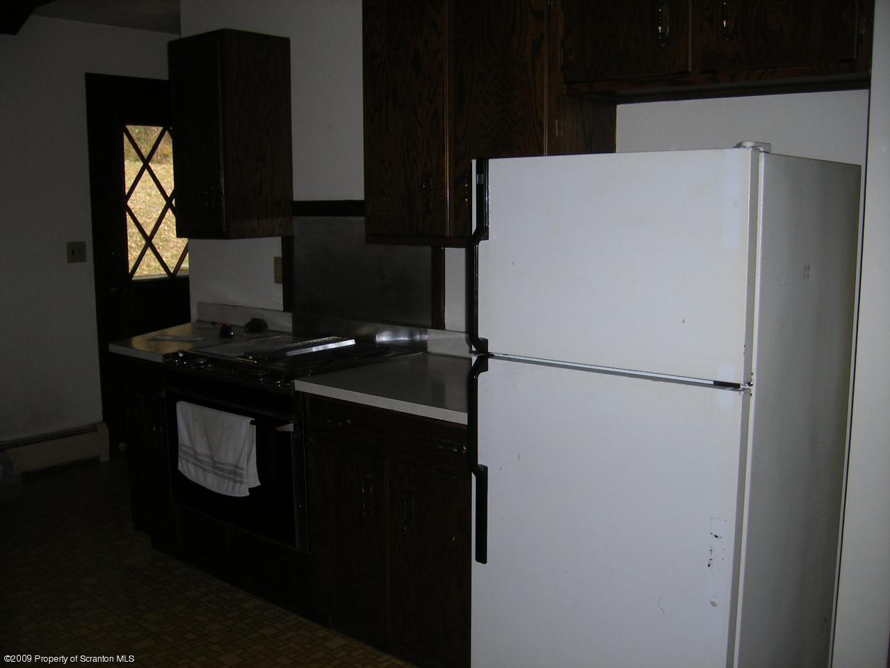 252 Lane Hill Road Tunkhannock, PA 18657 - Photo 3 of 8 a white refrigerator freezer sitting in a kitchen