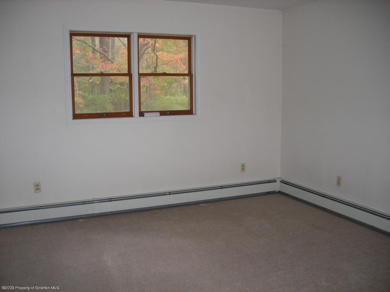 252 Lane Hill Road Tunkhannock, PA 18657 - Photo 5 of 8 an empty room with a window