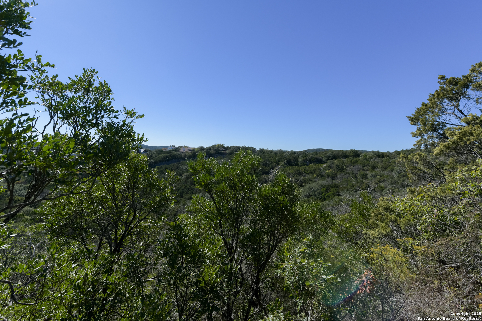 11266 Condor Pass Helotes, TX 78023 - Photo 2 of 7 a view of a green field