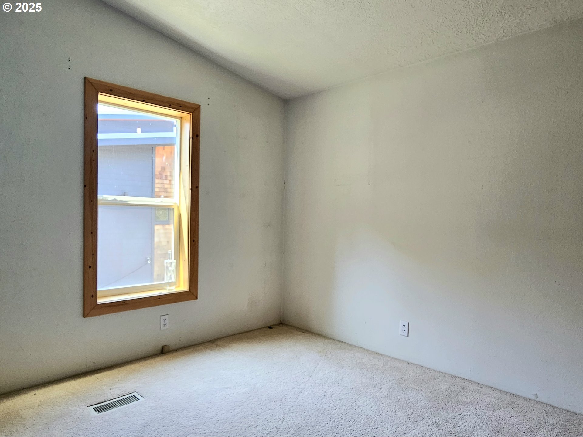 Undisclosed Address Brookings, OR 97415 - Photo 11 of 13 an empty room with windows and closet