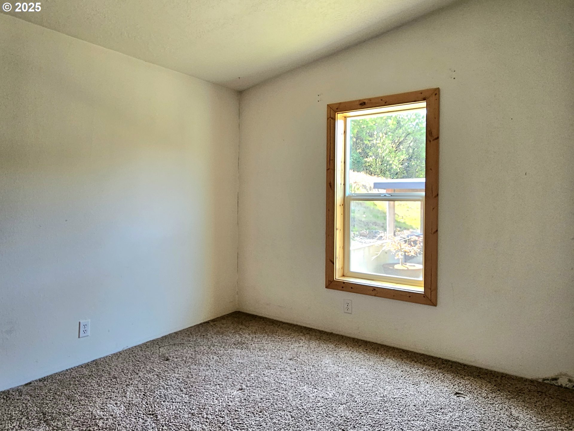 Undisclosed Address Brookings, OR 97415 - Photo 9 of 13 an empty room with a window