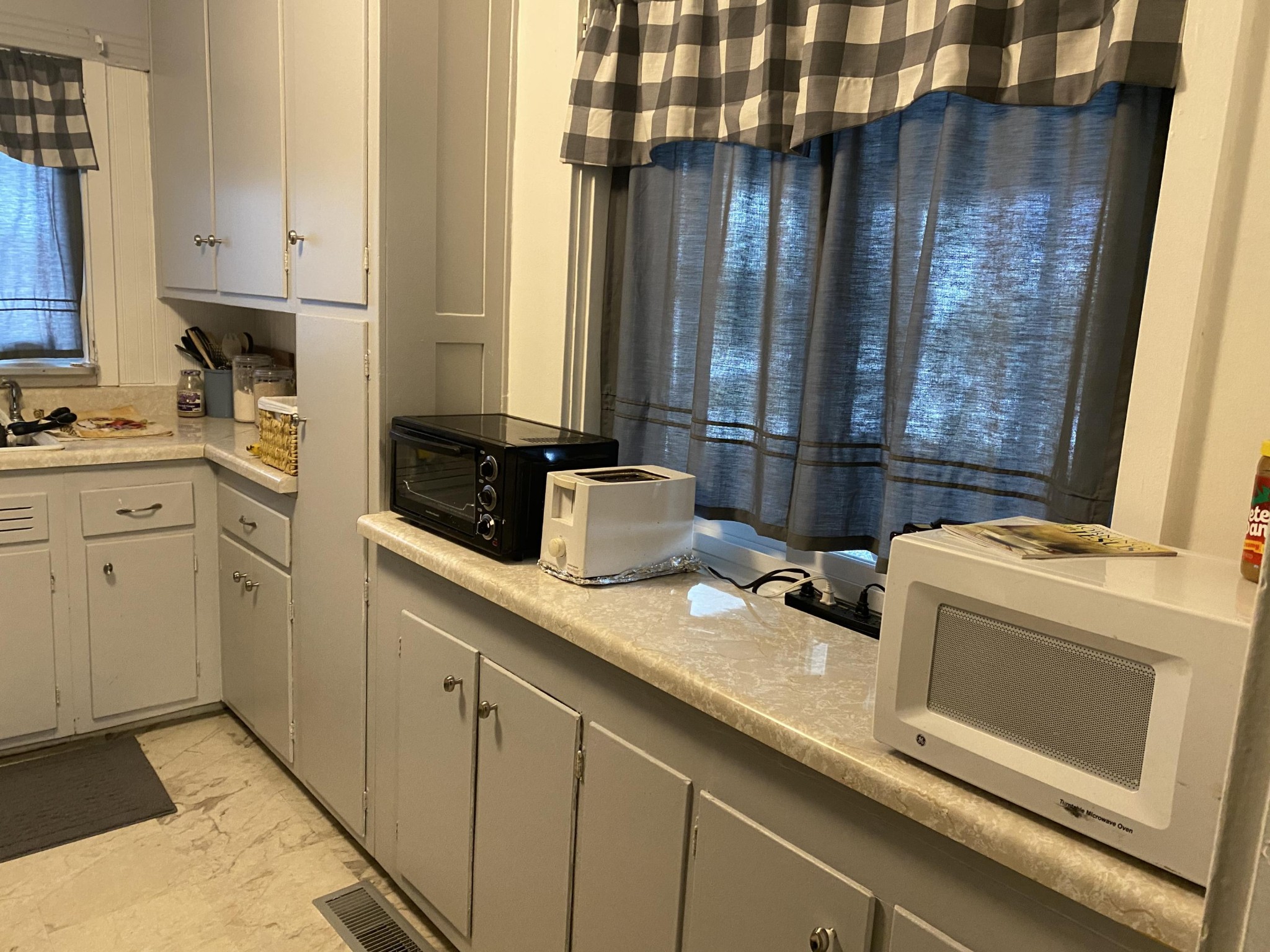 109 Tucker Road Oak Ridge, TN 37830 - Photo 7 of 20 a kitchen with a sink and cabinets