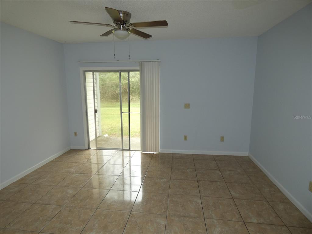 12080 Mendel Drive Orlando, FL 32826 - Photo 4 of 10 a view of an empty room and window chandelier fan