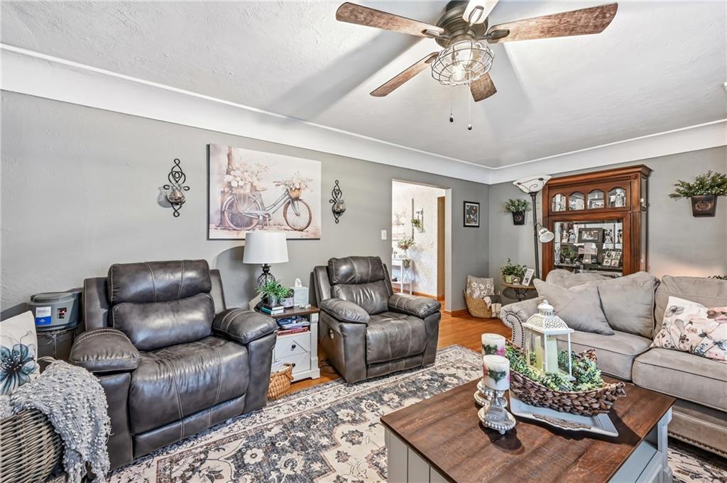 409 Patt Drive Farrell, PA 16121 - Photo 11 of 50 a living room with furniture and a flat screen tv