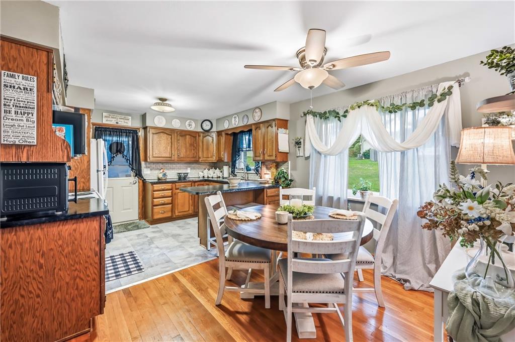 409 Patt Drive Farrell, PA 16121 - Photo 16 of 50 a view of a dining room with furniture window and wooden floor