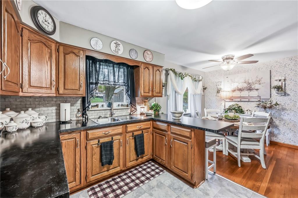 409 Patt Drive Farrell, PA 16121 - Photo 17 of 50 a kitchen with stainless steel appliances granite countertop a sink and cabinets