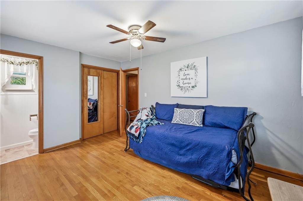 409 Patt Drive Farrell, PA 16121 - Photo 23 of 50 a bed room with a bed and a chandelier