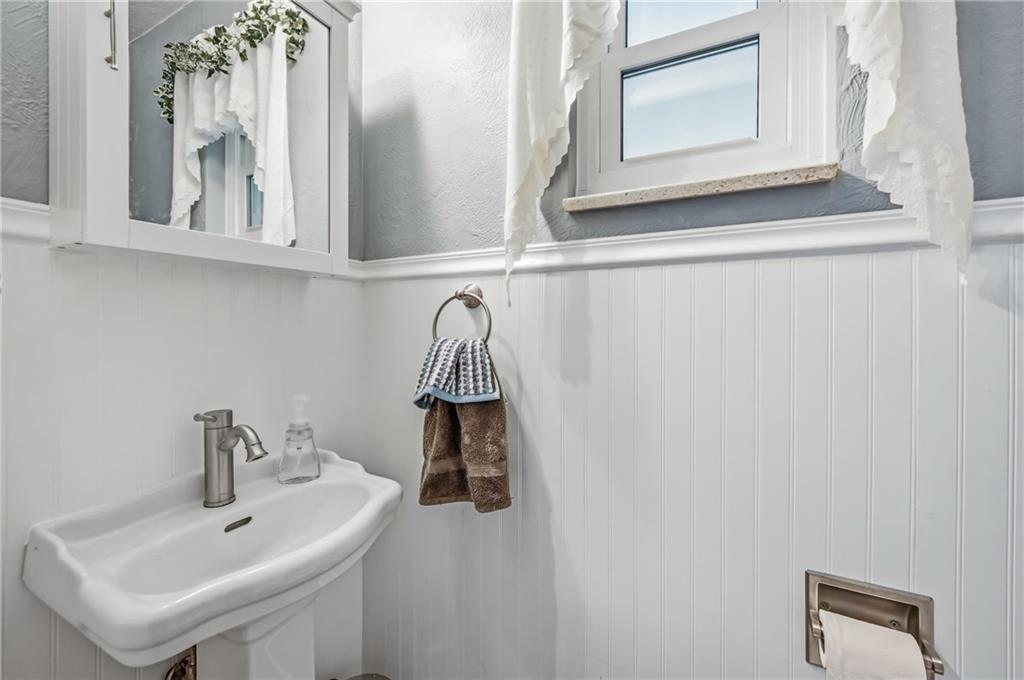 409 Patt Drive Farrell, PA 16121 - Photo 24 of 50 a bathroom with a sink and a mirror