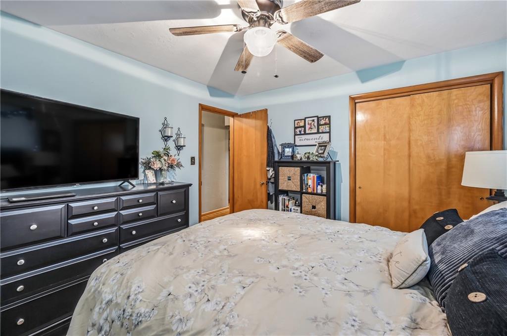 409 Patt Drive Farrell, PA 16121 - Photo 26 of 50 a bedroom with a bed and a flat screen tv