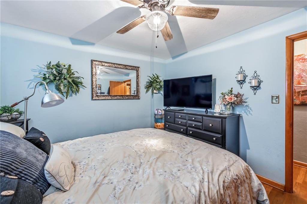 409 Patt Drive Farrell, PA 16121 - Photo 27 of 50 a bedroom with a bed and a flat screen tv
