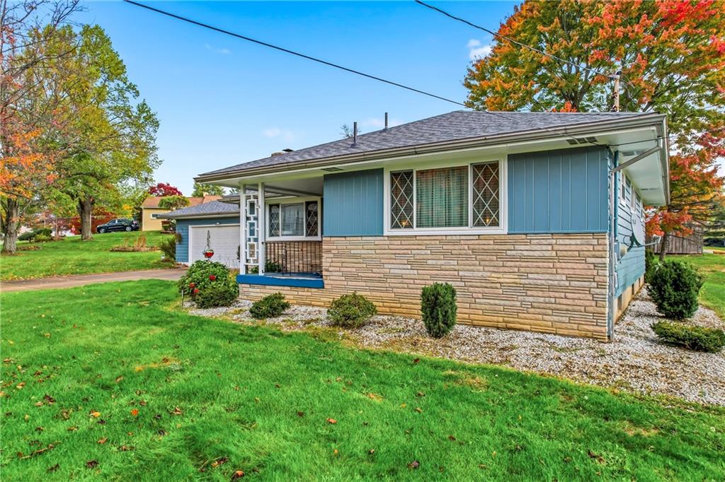 409 Patt Drive Farrell, PA 16121 - Photo 3 of 50 a front view of a house with a yard