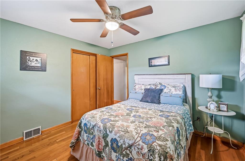 409 Patt Drive Farrell, PA 16121 - Photo 31 of 50 a bedroom with a bed and a lamp on table