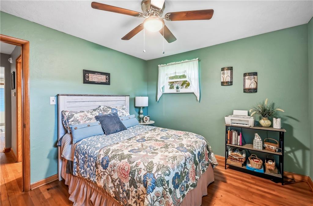 409 Patt Drive Farrell, PA 16121 - Photo 32 of 50 a bedroom with a bed and a bookshelf